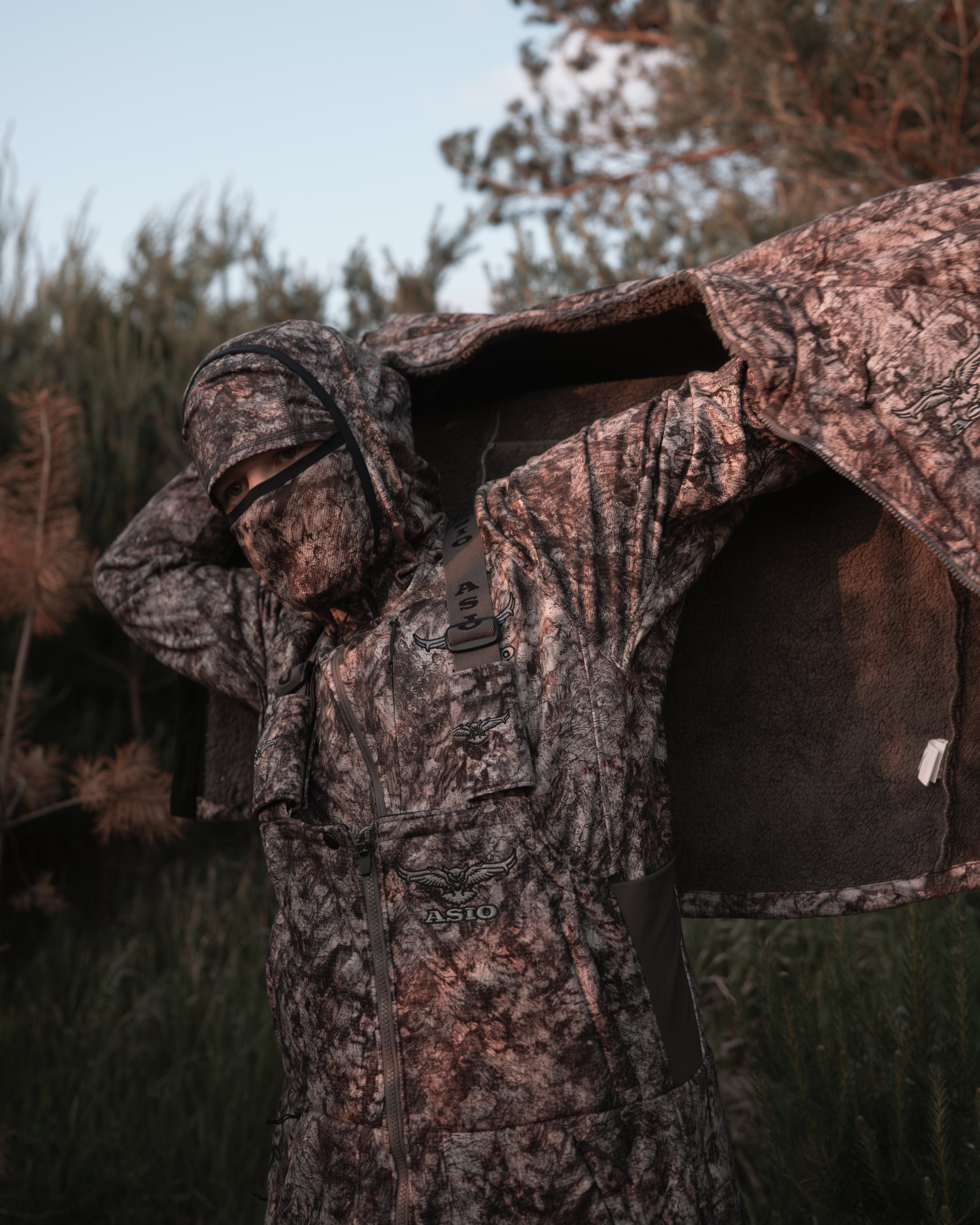 hunter dressing with asio gear raptor camo mid season windproof sherpa bowhunting jacket