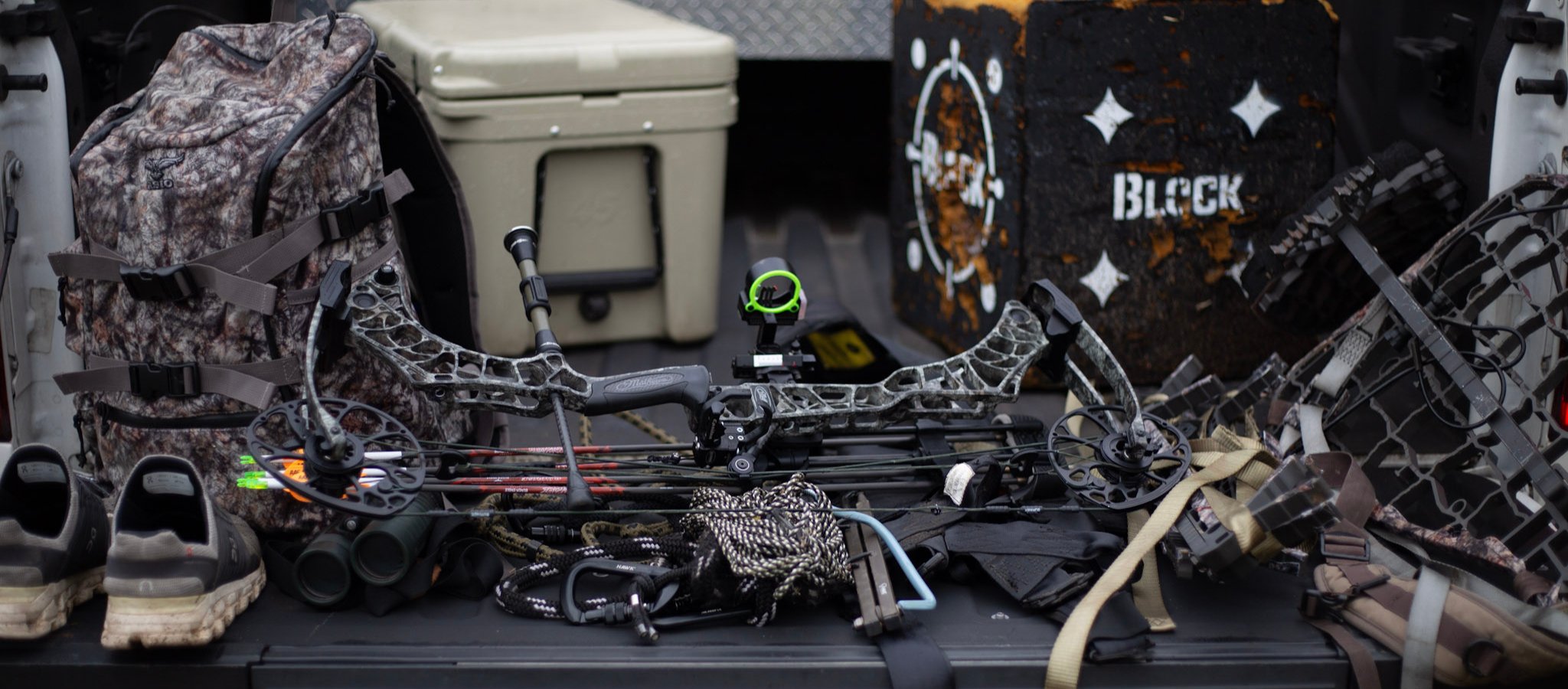 asio gear layed out on truck bed in preparation for a whitetail bow hunt. cut no corners. make sure all your gear is ready to go